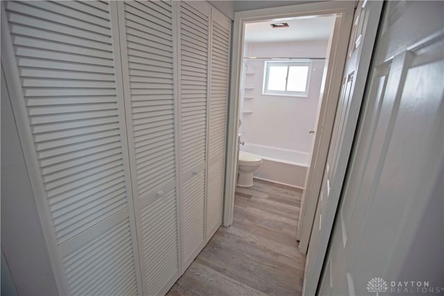 corridor featuring light wood-style floors