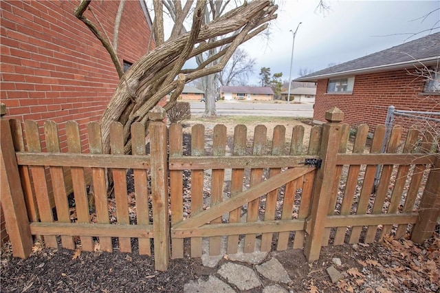 view of gate with fence