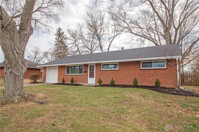 ranch-style house with a front lawn, brick siding, and an attached garage