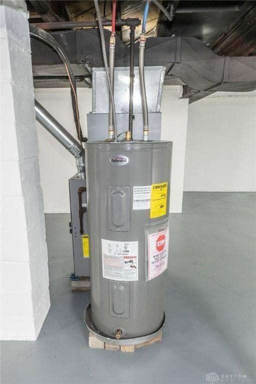 utility room with electric water heater