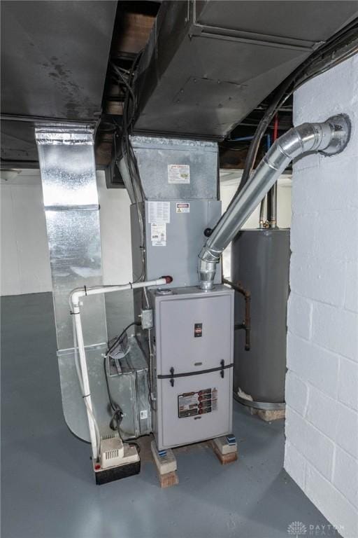 utility room featuring gas water heater