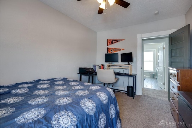 bedroom with lofted ceiling, carpet, ceiling fan, and a textured ceiling