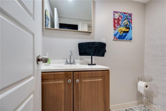 bathroom featuring vanity and baseboards