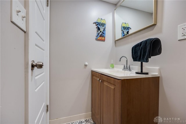 bathroom with vanity and baseboards