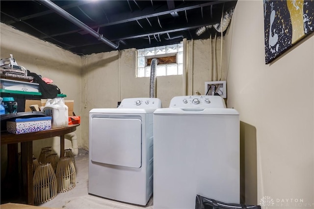 washroom featuring laundry area and washer and clothes dryer