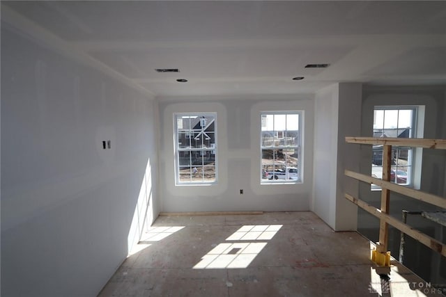 empty room featuring visible vents and a wealth of natural light