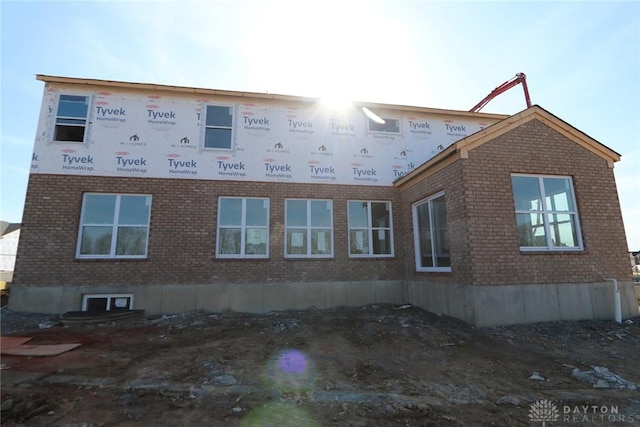view of side of property with brick siding