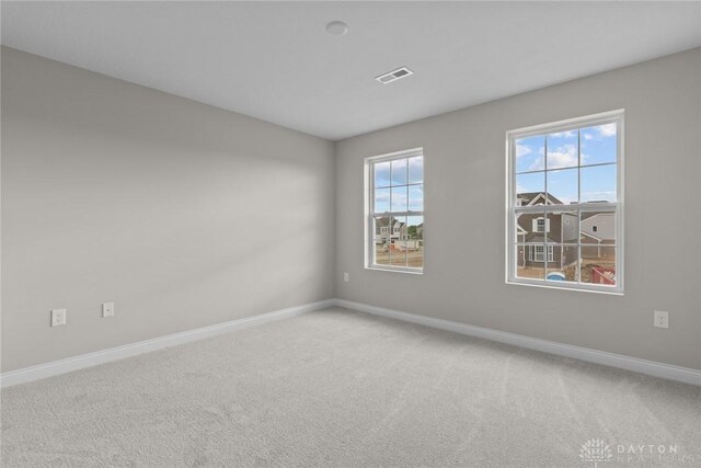 2881 Sky Crossing Dr Unit 55, Beavercreek, OH 45434 - spare room with baseboards and carpet
