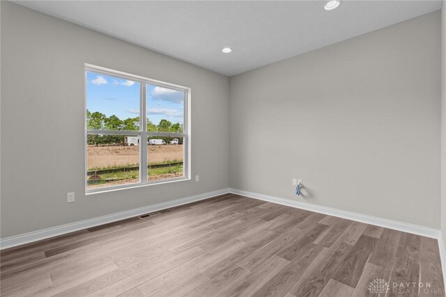 2881 Sky Crossing Dr Unit 55, Beavercreek, OH 45434 - spare room featuring wood finished floors, baseboards, and recessed lighting