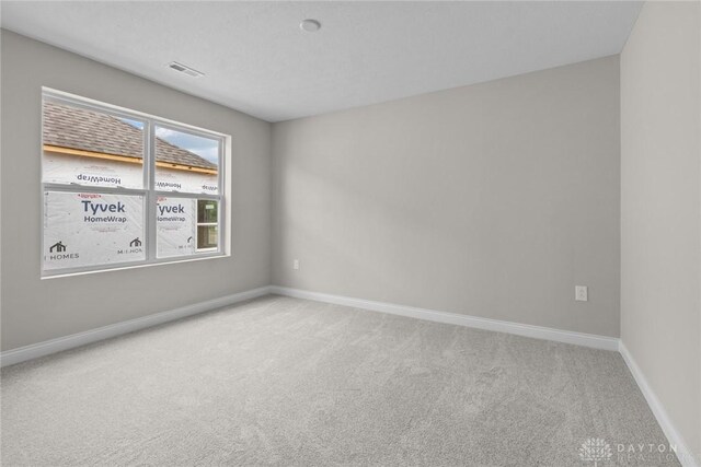 2881 Sky Crossing Dr Unit 55, Beavercreek, OH 45434 - spare room featuring carpet floors and baseboards