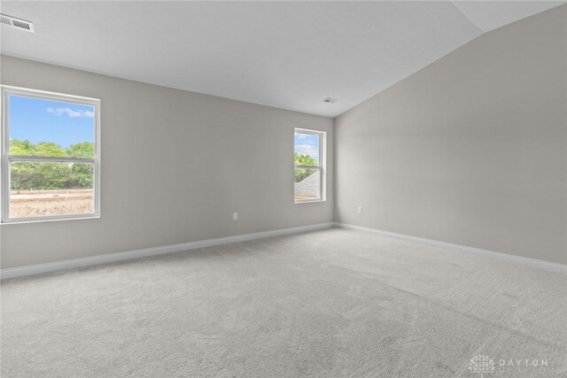 2881 Sky Crossing Dr Unit 55, Beavercreek, OH 45434 - spare room featuring lofted ceiling, baseboards, and carpet floors