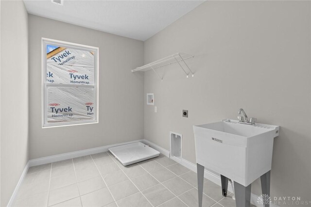 2881 Sky Crossing Dr Unit 55, Beavercreek, OH 45434 - clothes washing area with hookup for a washing machine, hookup for an electric dryer, baseboards, and light tile patterned flooring