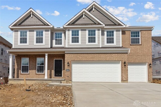 2881 Sky Crossing Dr Unit 55, Beavercreek, OH 45434 - view of front facade with a garage, concrete driveway, and brick siding