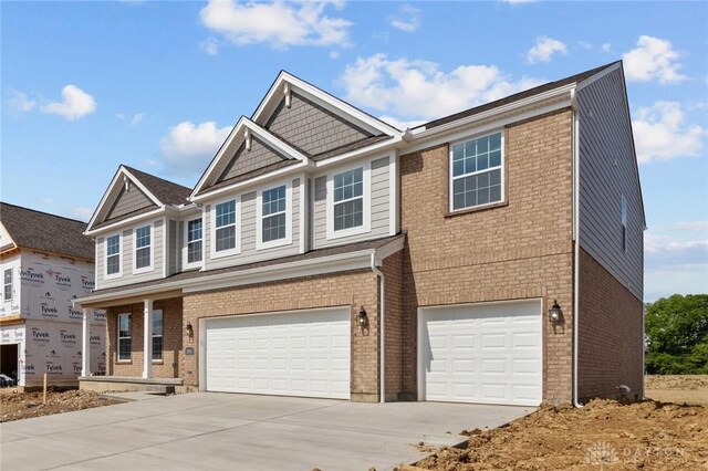 2881 Sky Crossing Dr Unit 55, Beavercreek, OH 45434 - view of front of property featuring an attached garage, concrete driveway, and brick siding