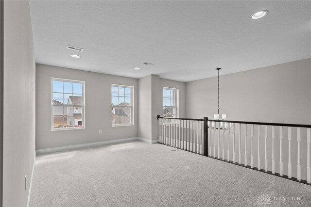 2881 Sky Crossing Dr Unit 55, Beavercreek, OH 45434 - spare room featuring carpet floors, a chandelier, baseboards, and recessed lighting