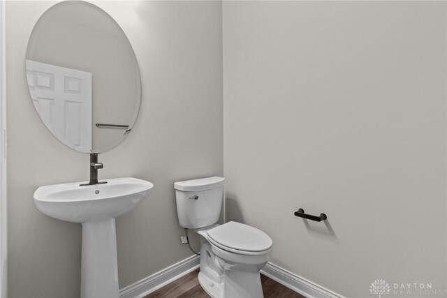 2881 Sky Crossing Dr Unit 55, Beavercreek, OH 45434 - half bath featuring toilet, wood finished floors, and baseboards