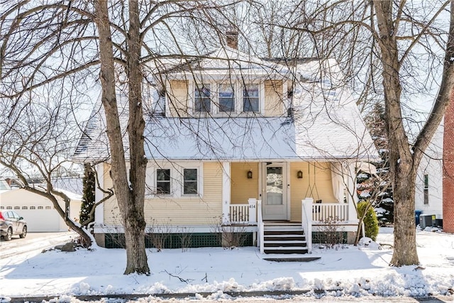 view of front of house featuring a garage and central AC unit