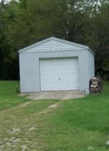 detached garage featuring driveway