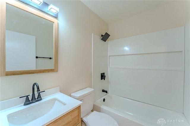 bathroom with toilet, washtub / shower combination, and vanity