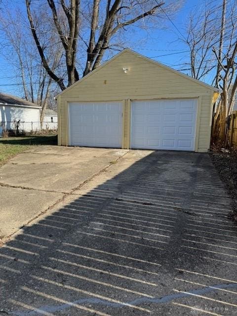 detached garage with fence