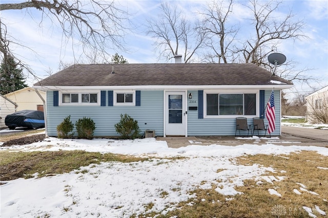 view of front of house with a shingled roof