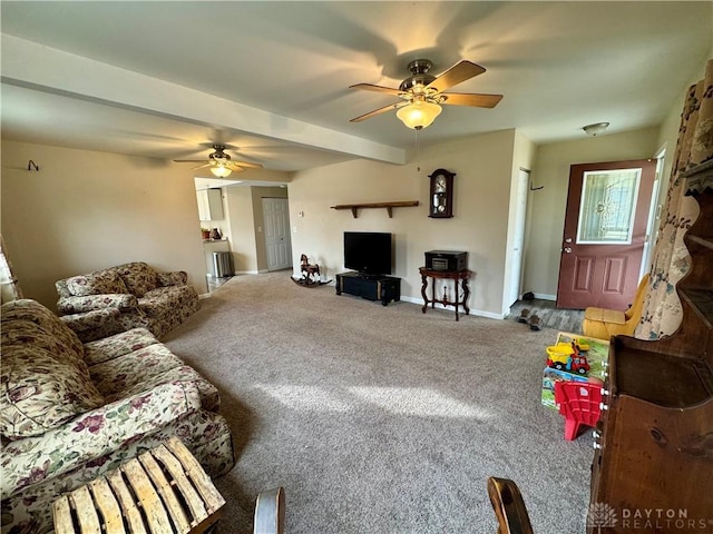 carpeted living room featuring baseboards and a ceiling fan