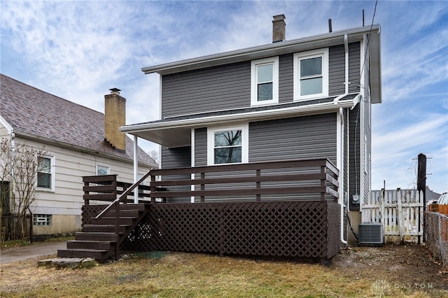 rear view of property with central AC unit, stairs, a chimney, and fence