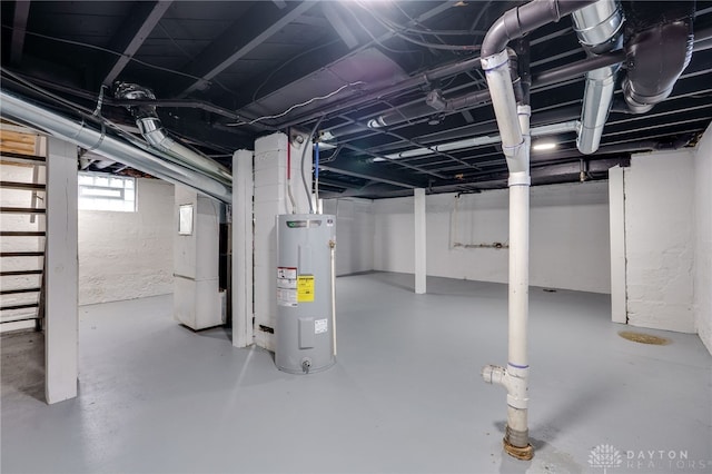 below grade area featuring water heater