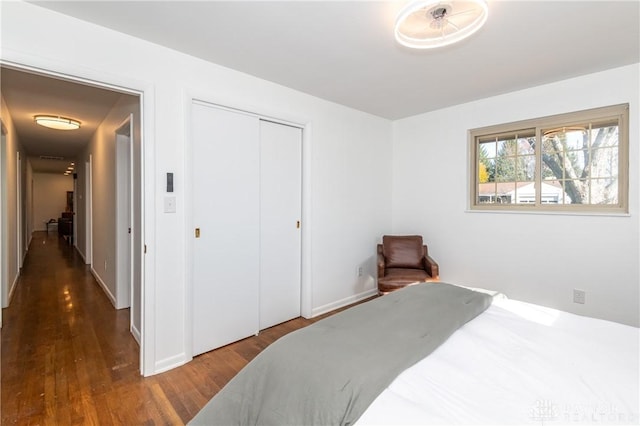 bedroom featuring a closet and wood finished floors