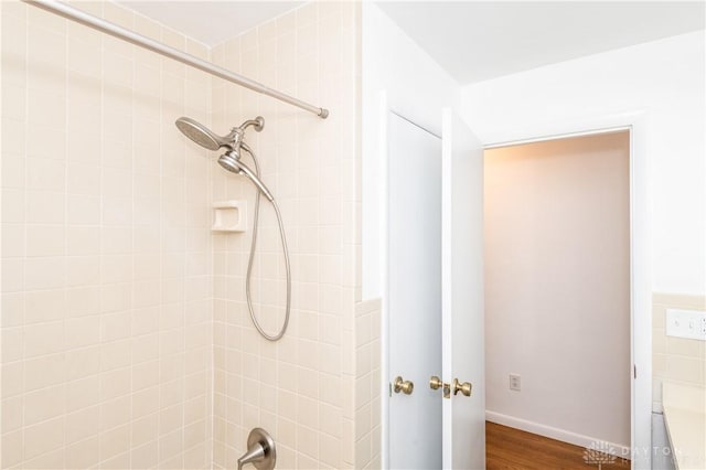 full bathroom with shower / bath combination and wood finished floors