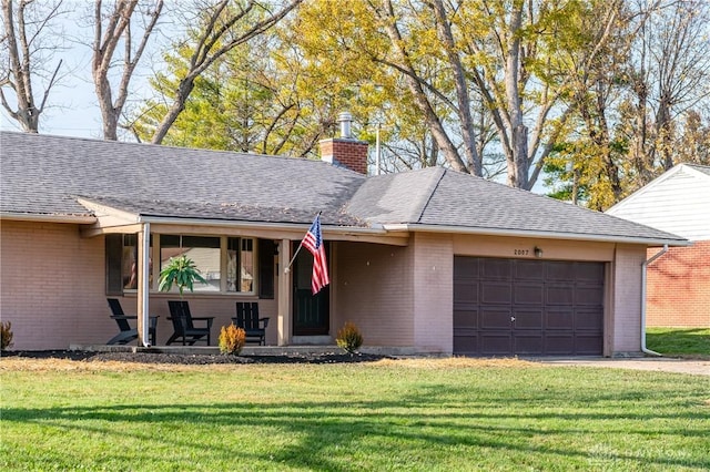 ranch-style house with brick siding, an attached garage, a chimney, and a front lawn