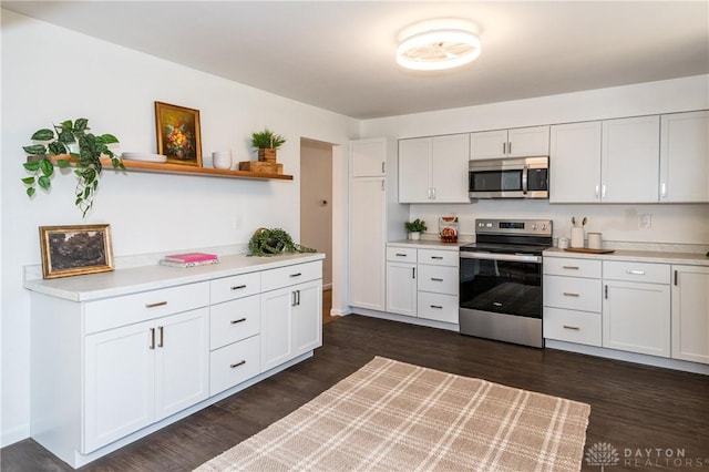 kitchen featuring open shelves, appliances with stainless steel finishes, light countertops, and white cabinets