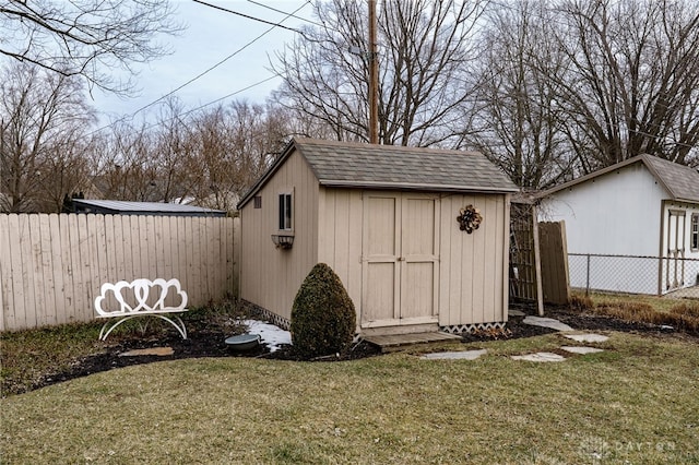 view of shed featuring a fenced backyard