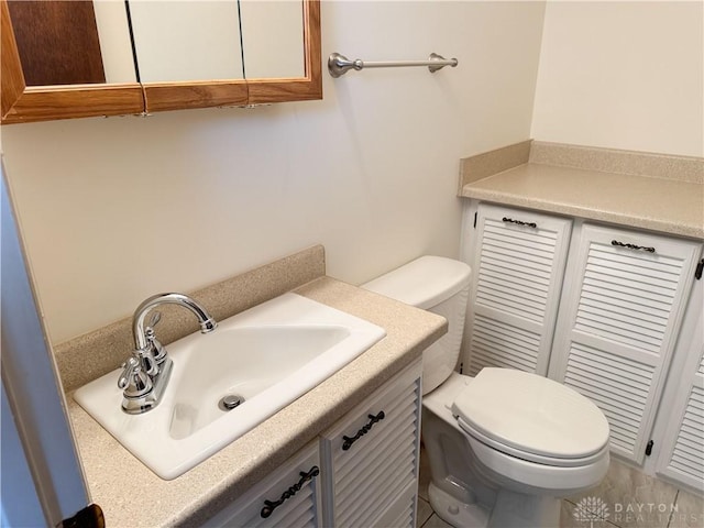 bathroom with toilet and vanity