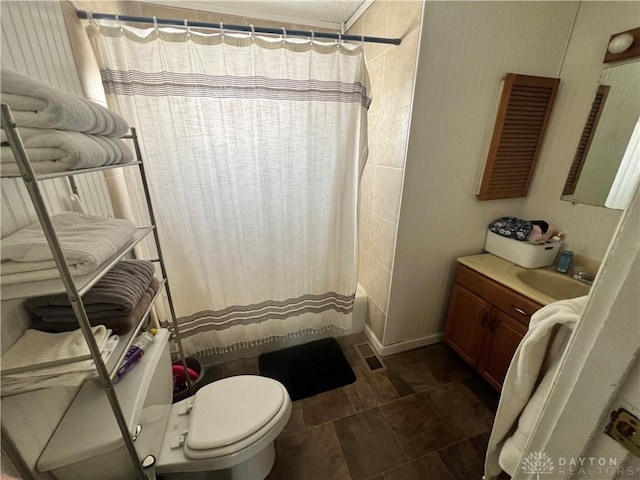 bathroom featuring toilet, visible vents, shower / bath combo with shower curtain, and vanity