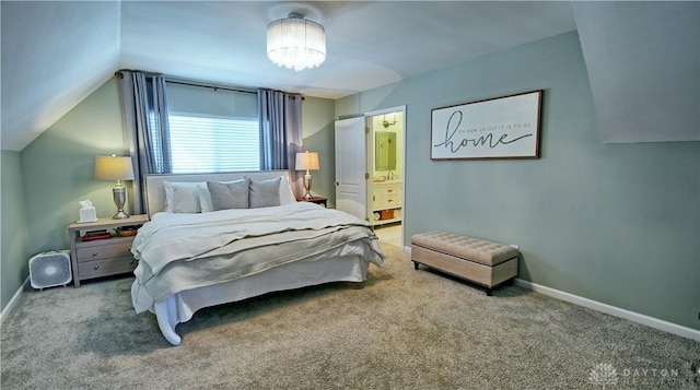 bedroom featuring lofted ceiling, carpet flooring, connected bathroom, and baseboards