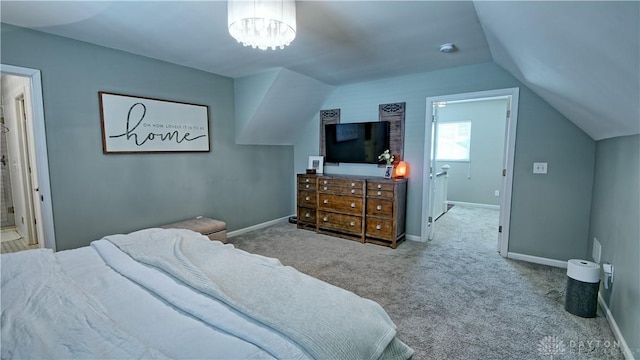 carpeted bedroom with baseboards, vaulted ceiling, and a notable chandelier