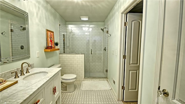 bathroom featuring visible vents, toilet, tile patterned floors, vanity, and a shower stall