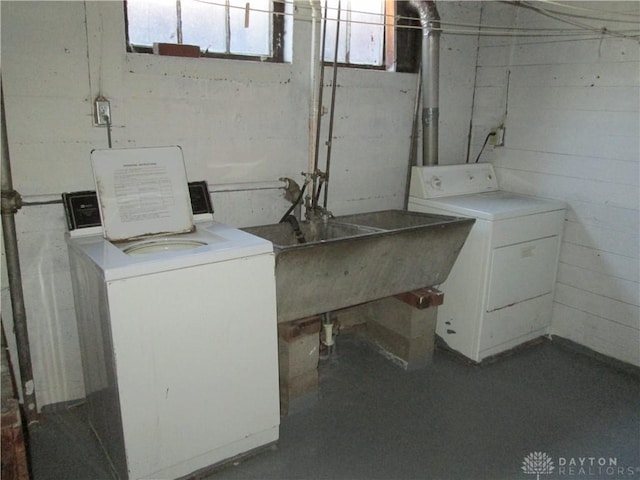 laundry room featuring laundry area, a sink, and washer and clothes dryer