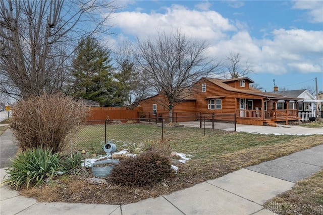 view of property exterior featuring covered porch, fence, and a lawn