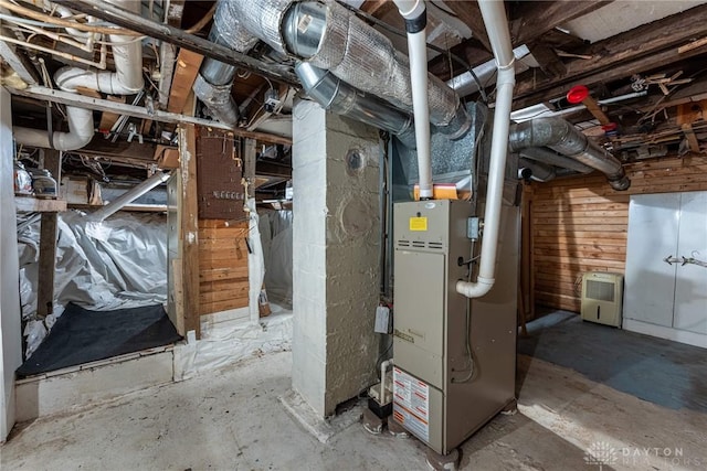 utility room with heating unit