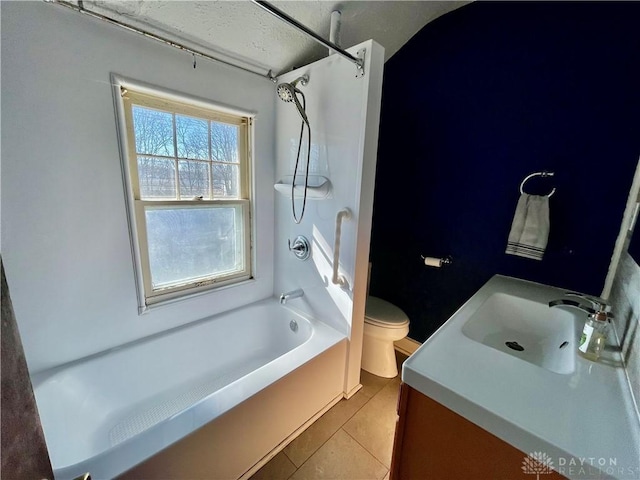 full bathroom featuring tile patterned flooring, tub / shower combination, vanity, and toilet