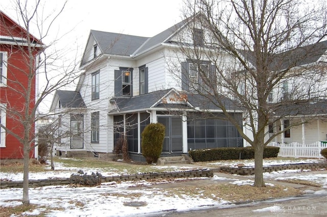 view of front of home with a sunroom