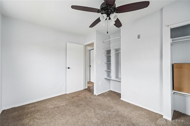 unfurnished bedroom featuring carpet, baseboards, and ceiling fan