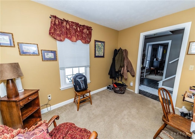 sitting room with carpet and baseboards