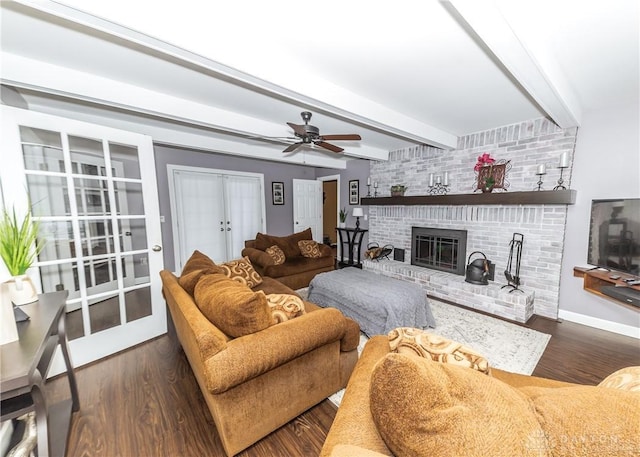 living room with french doors, a fireplace, wood finished floors, beamed ceiling, and baseboards