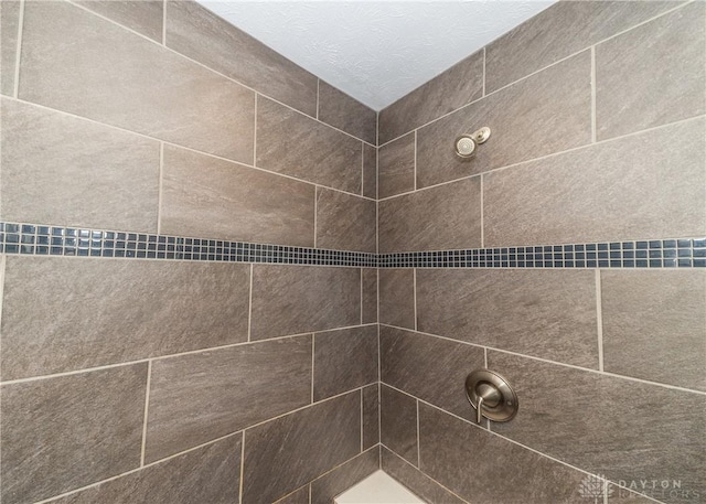 details with a tile shower