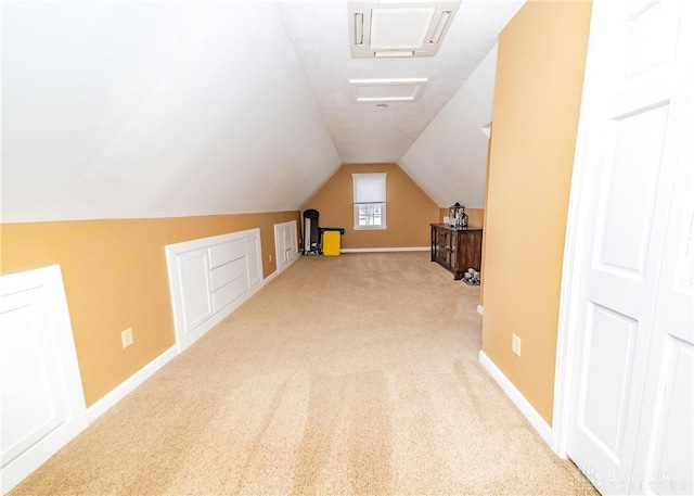 bonus room with lofted ceiling, carpet flooring, and baseboards