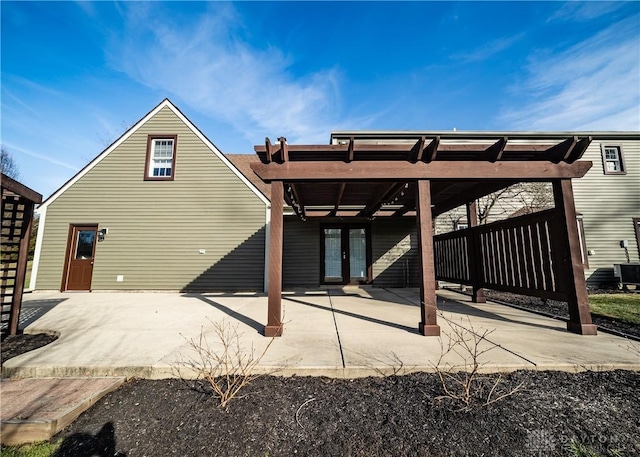 rear view of property with french doors