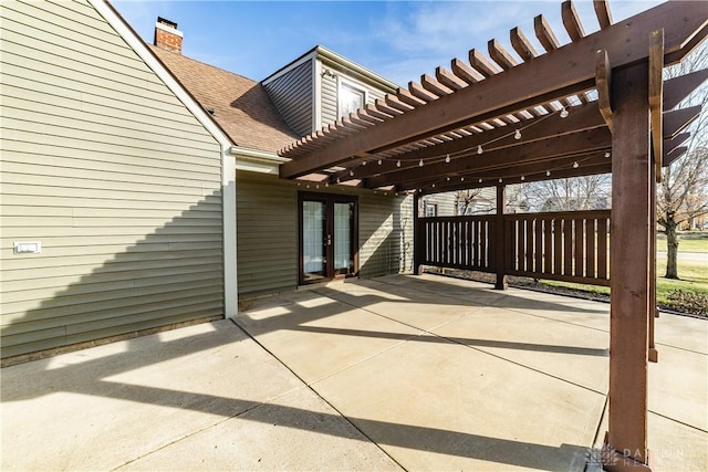 view of patio / terrace with french doors and a pergola